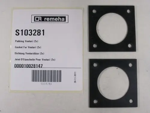 Zwei schwarze Dichtungen mit runder Öffnung und gebohrten Löchern, verpackt mit einer Remeha-Produktbeschreibung und Barcode.
